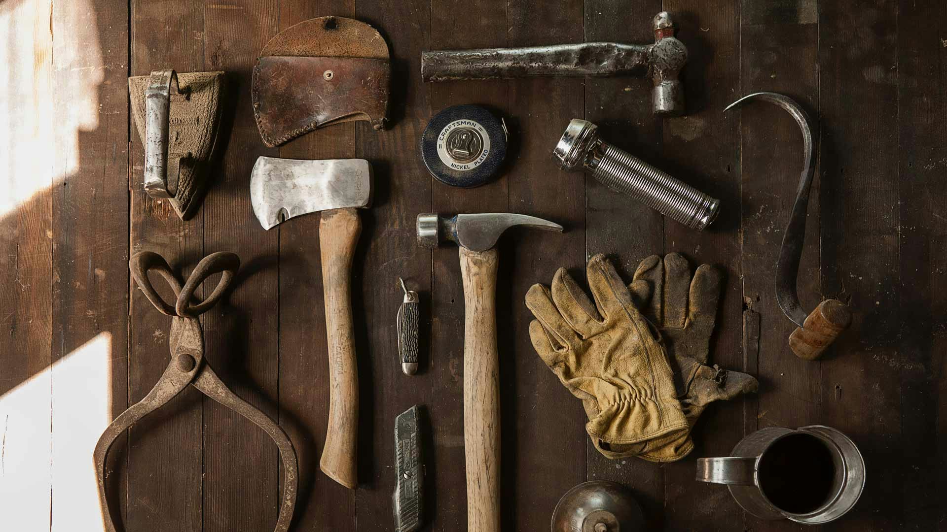 Tools Laid Out on Wood Floor